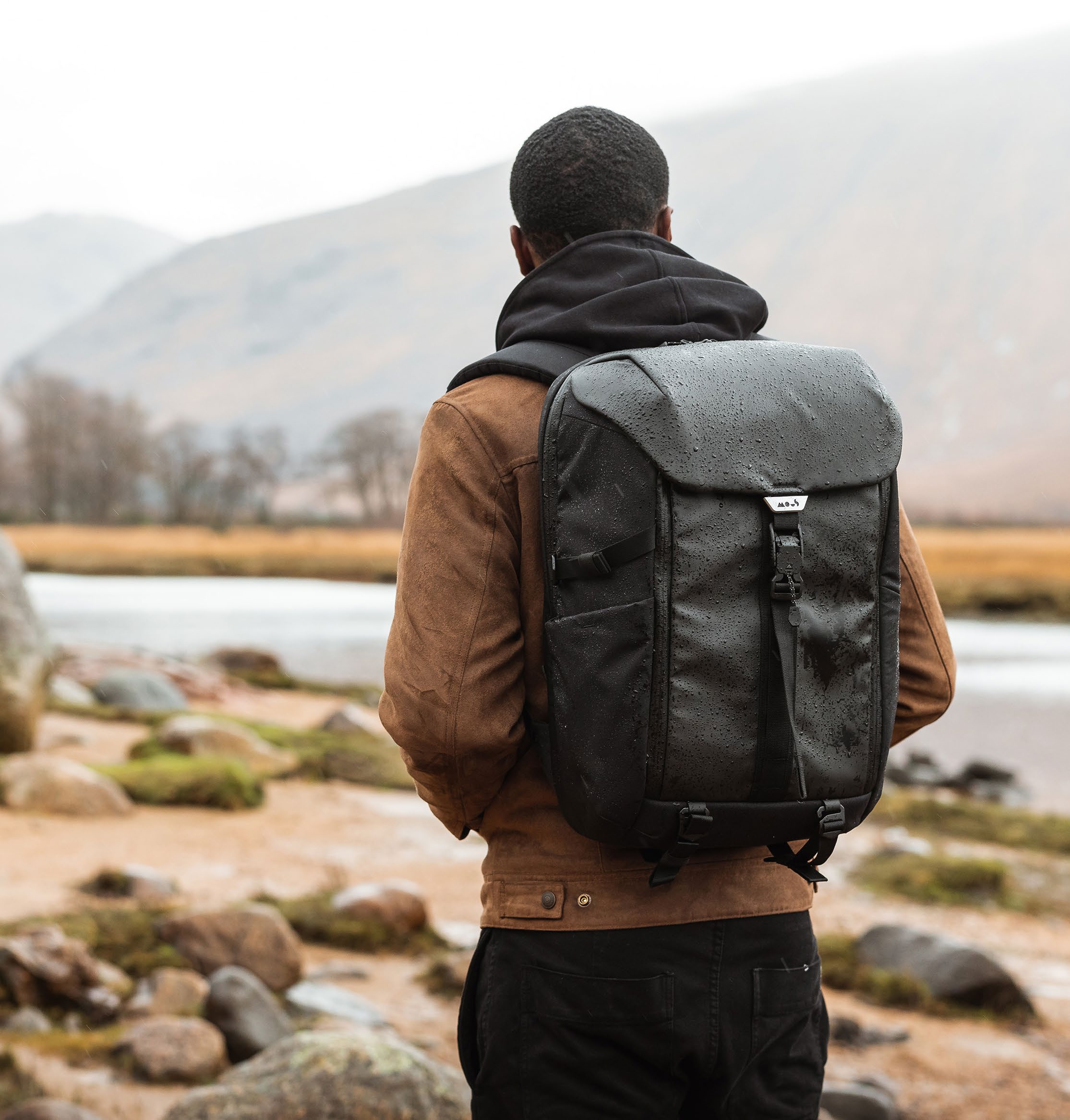 Person wearing a Mous backpack outdoors